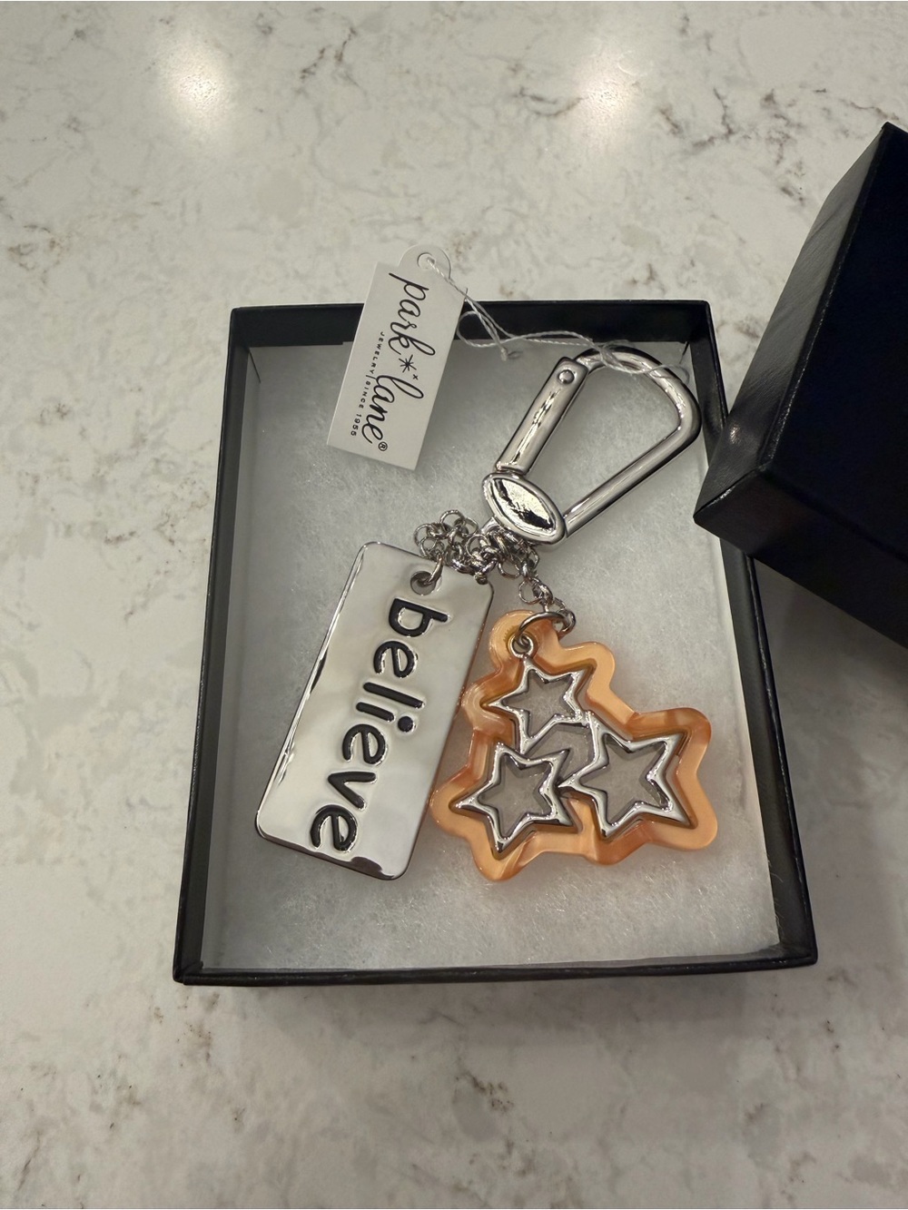 Park Lane silver-tone 'believe' keychain with orange star charms